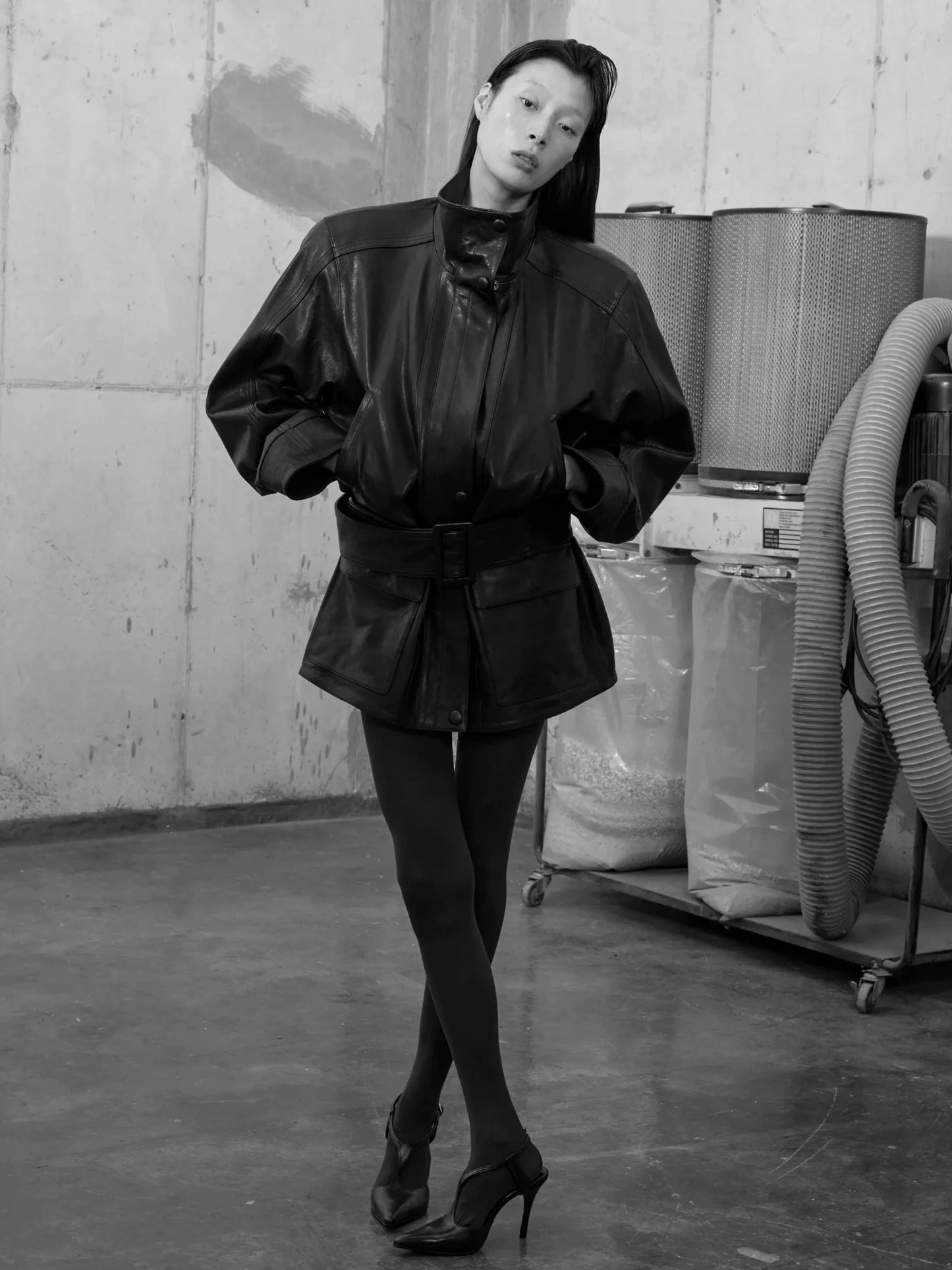 black sculpted leather blouson with stand collar and removable wide belt-b&w