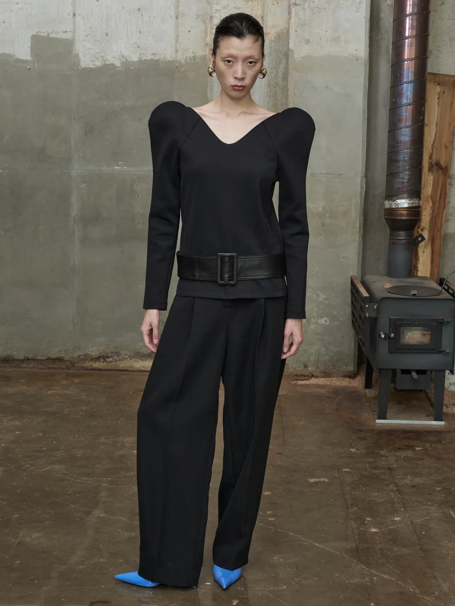 black sculptural blouse with curved neckline and molded structured shoulders-1