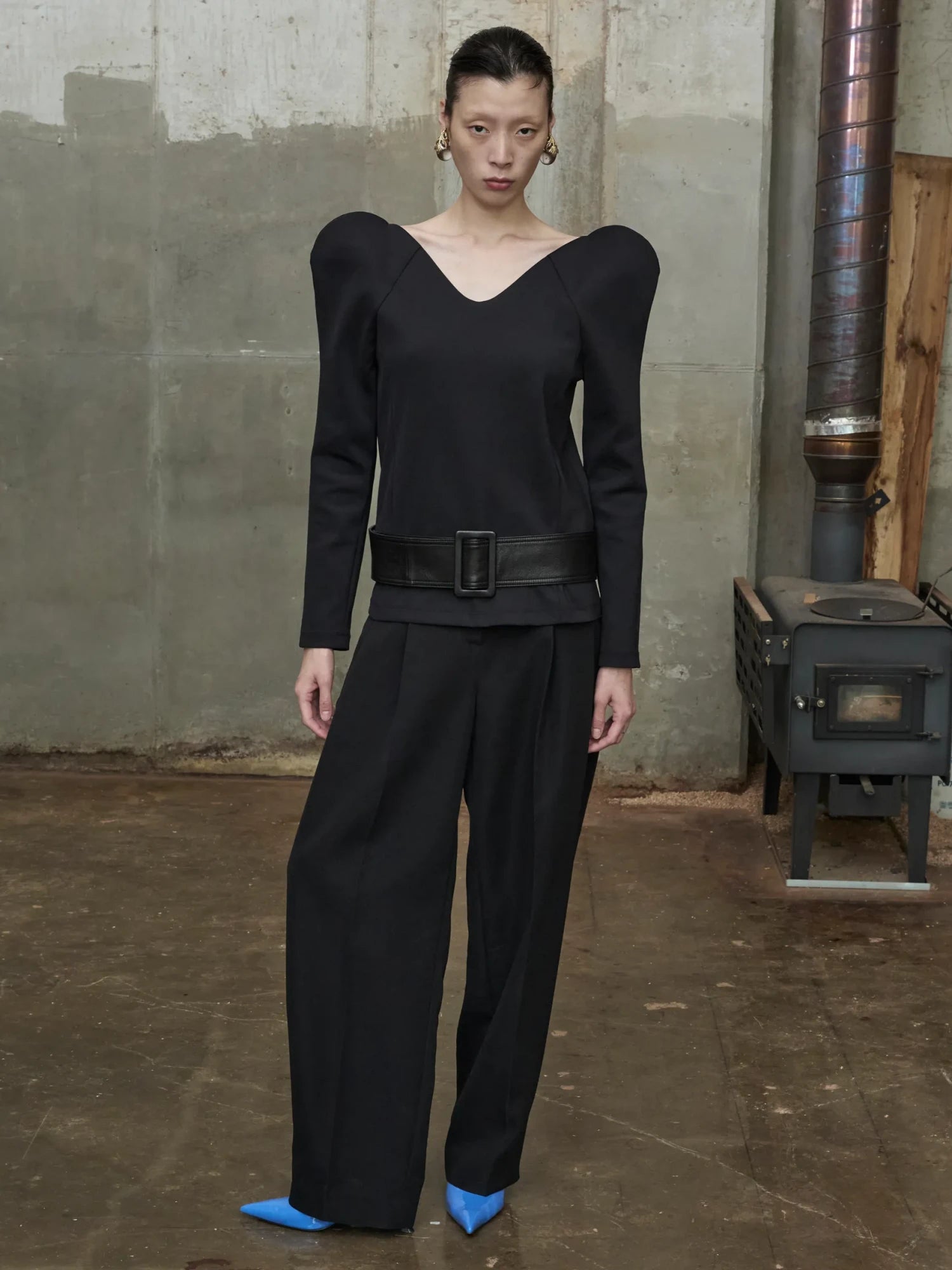 black sculptural blouse with curved neckline and molded structured shoulders-1